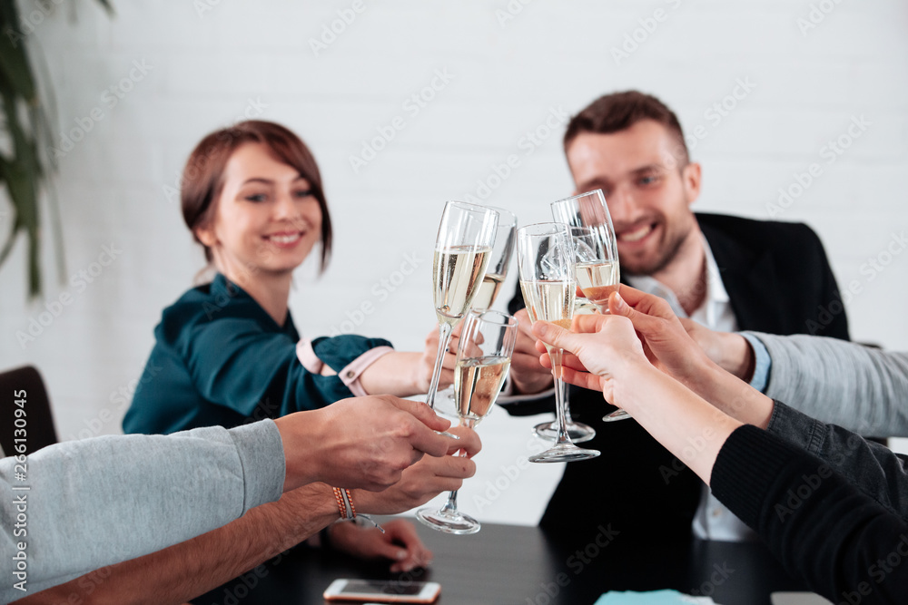 Well done work success young business people toasting each other and smiling while standing in the board room coworking, drink champagne celebrate christmas birthday new year contract Well done work success young business people toasting each other and smiling while standing in the board room coworking, drink champagne celebrate christmas birthday new year contract