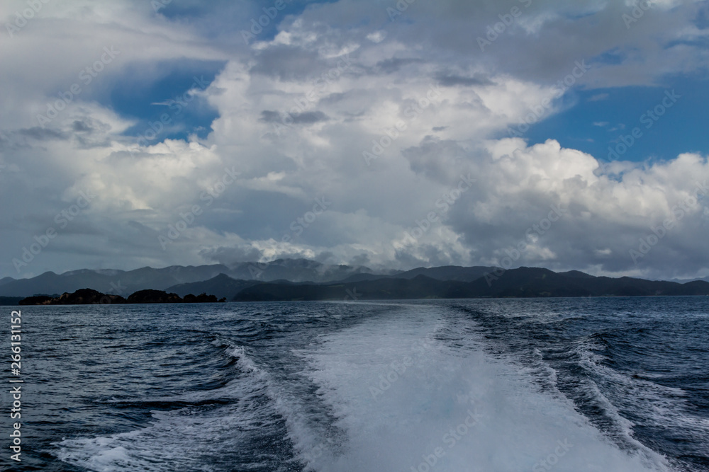 Stormy, skies, blue skies, dotted rock islands are a pleasant view durinf a cruise around the Bay of Islands