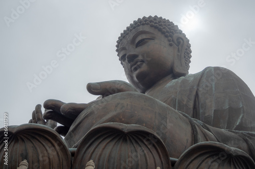 Canvas Print Low angle of Tian tan the great buddha in hongkong on clouds sky background with
