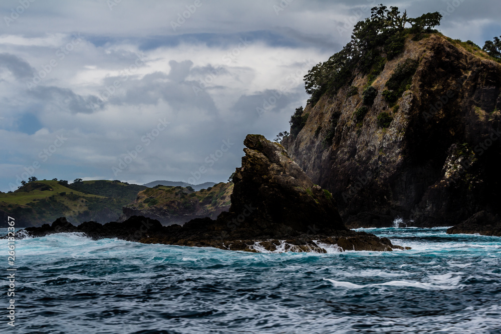 Waves crash against the rocks, Bay of Islands, New Zealand