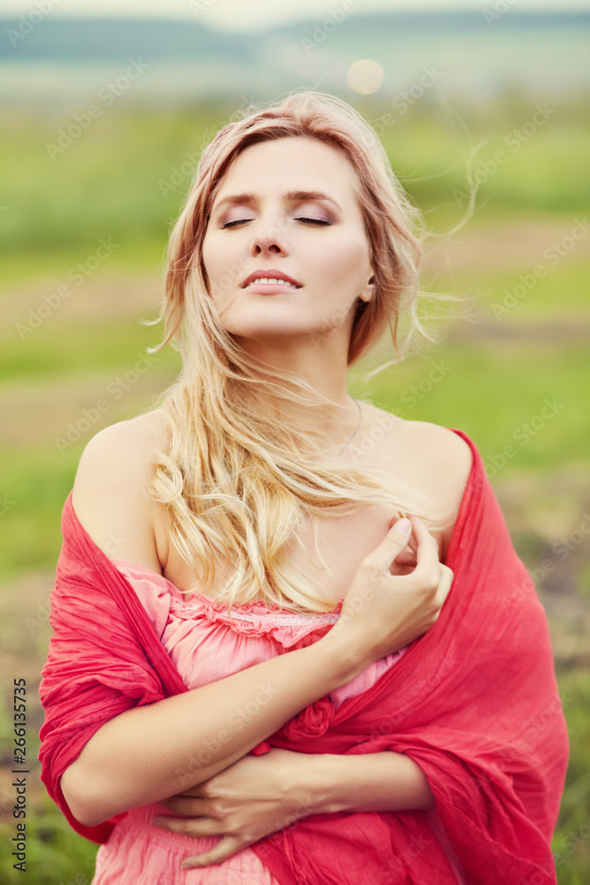 Fototapeta premium outdoor portrait of a middle aged sexy blonde woman