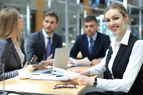 business woman with her staff, people group in background at modern bright office indoors.