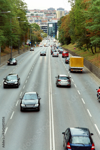 motorway out of city. going cars on the road.