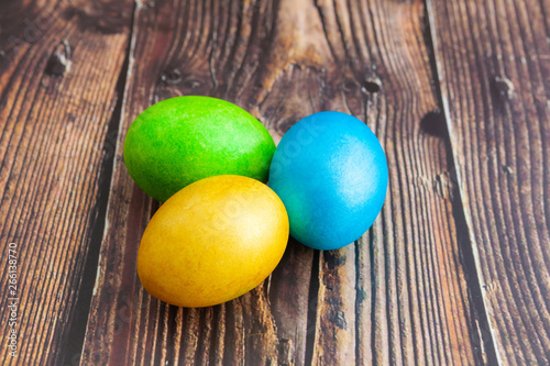 Close-up. Beautiful colorful Easter eggs. Easter concept on dark wooden background