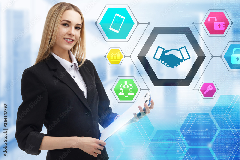 The concept of business, technology, the Internet and the network. A young entrepreneur working on a virtual screen of the future and sees the inscription: The concept of business, technology, the Internet and the network. A young entrepreneur working on a virtual screen of the future and sees the inscription: