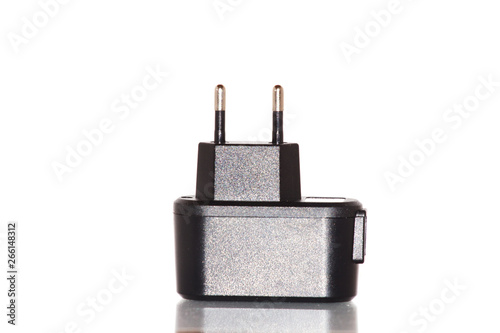 Black charger for power outlet on a white isolated background