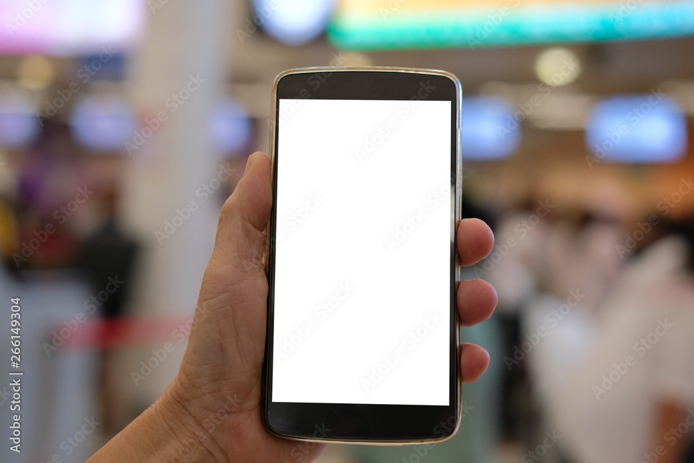 hand holding mobile smart phone at airport hand holding mobile smart phone at airport