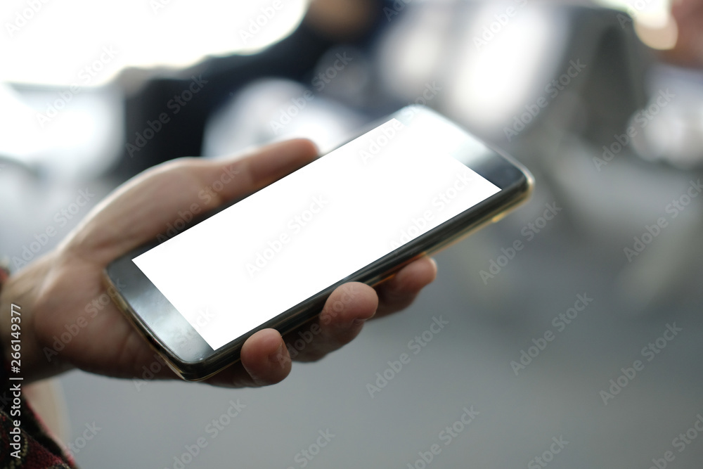 hand holding mobile smart phone at airport hand holding mobile smart phone at airport