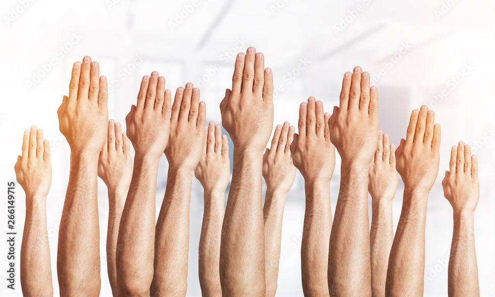 Row of man hands showing voting gesture Row of man hands showing voting gesture