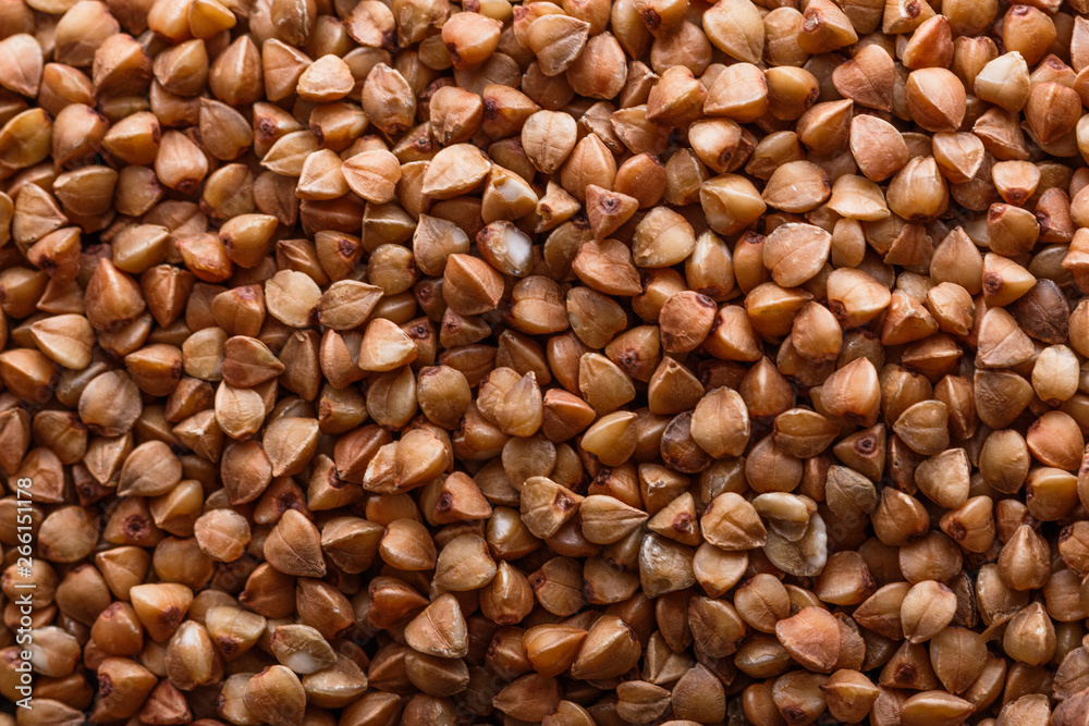 Grain buckwheat on a dark stone background Grain buckwheat on a dark stone background