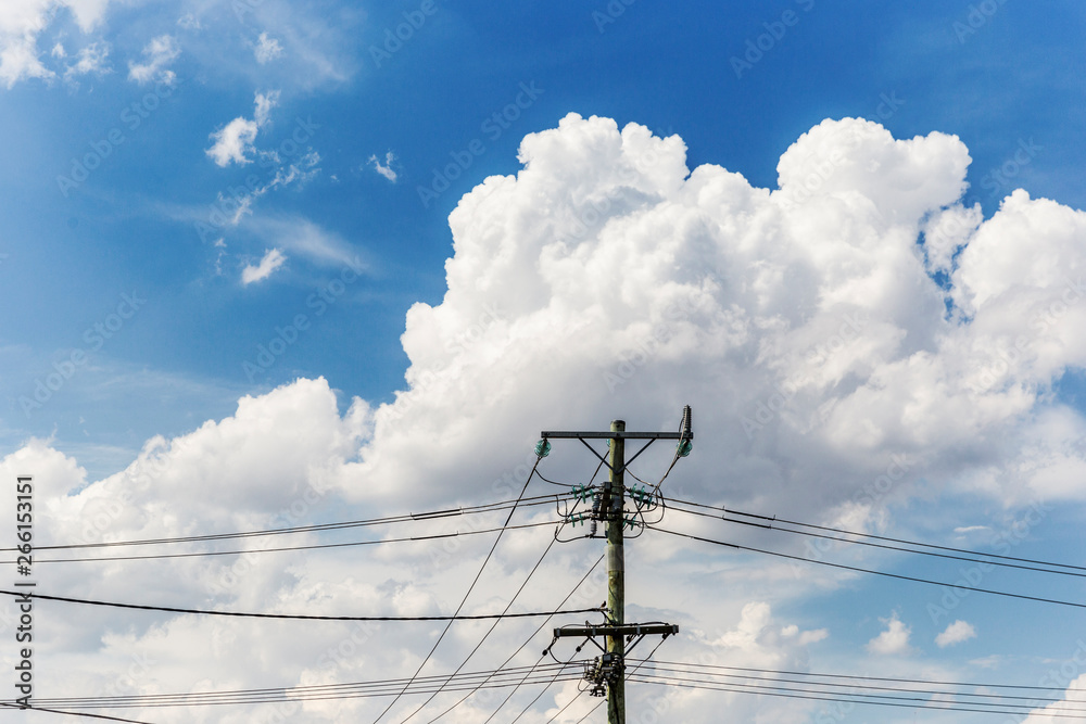 Cloudscape building behind electricity pylon on beautiful summers day. Cloudscape building behind electricity pylon on beautiful summers day.