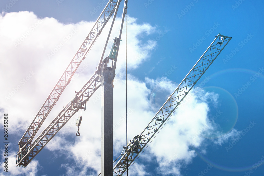 Crane on blue sky with clouds background. Construction Machinery