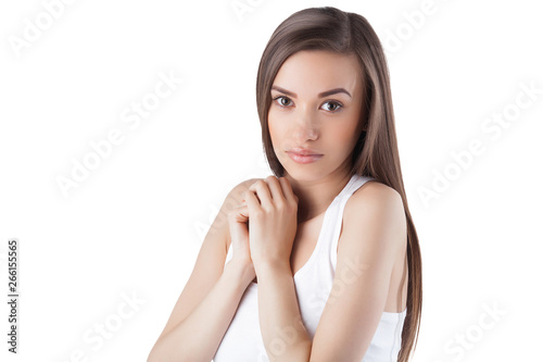 Young attractive woman on isolated white background. Female facial portrait. Closeup portrait of beautiful lady. photo