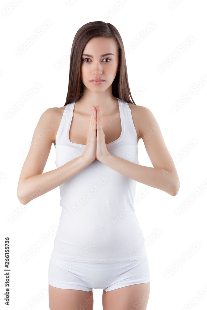 Young woman posing on isolated white background yoga exercises. Female in studio. Young woman posing on isolated white background yoga exercises. Female in studio.