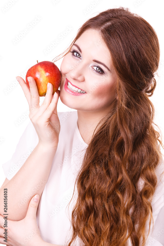 Woman holds apple fruit close to face, isolated Woman holds apple fruit close to face, isolated