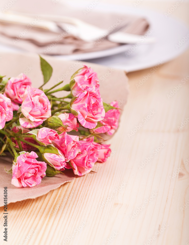 Rose bouquet on table setting Rose bouquet on table setting