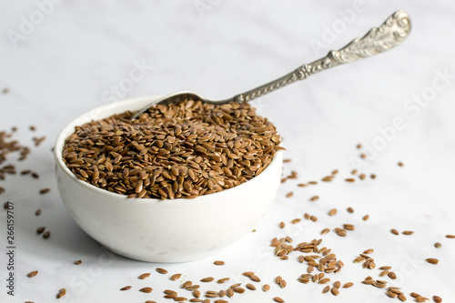 Bowl of flax seeds with spoon