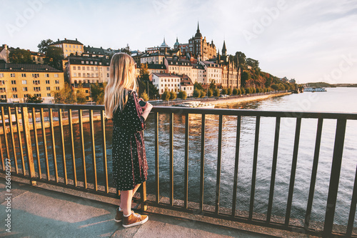 Photography Woman traveling in Stockholm city enjoying view from bridge summer vacations in