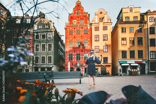 Young woman traveling in Stockholm sightseeing Gamla Stan Stortorget architecture lifestyle summer vacations in Sweden