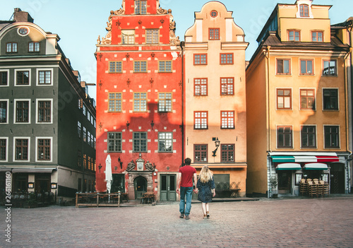 Romantic vacations couple in love traveling together in Stockholm Stortorget architecture colorful houses Sweden landmarks