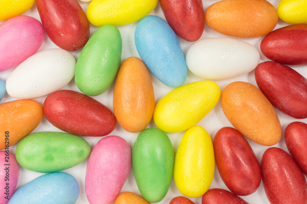 background of candy meringue eggs in pink, yellow, green, orange, red, white and blue background of candy meringue eggs in pink, yellow, green, orange, red, white and blue