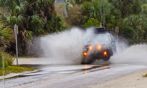 VENICE, FL - Jan 17 - Popular four-wheel-drive vehicle plows through street flooding in Florida due to El Nino on Jan 17, 2016 CR2