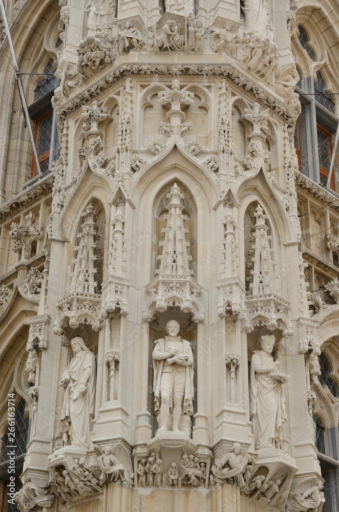 Statues at facade of city hall in Leuven, Belgium