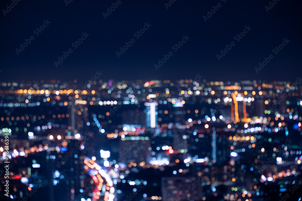Fototapeta premium Defocused lights in the Bangkok city in Thailand. the bokeh light from light of building and traffic in the city, abstract background