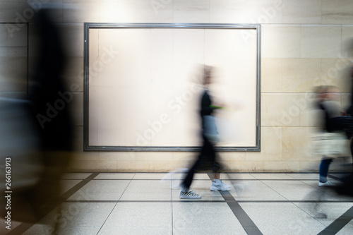 picture of people walking on a street in the city, with camera made motion blur effect