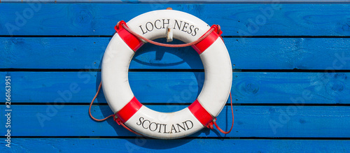 Foto Lifebelt with Loch Ness Scotland Lettering on wooden Background Caledonian Canal