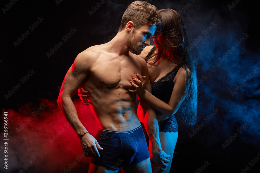 half-naked sexy couple express intimate feeling. close up photo. isolated black backgroundwith