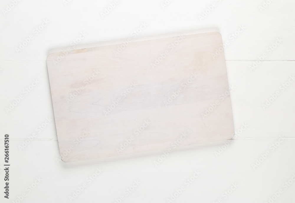 Empty white cutting board on white wooden table background top view from above Empty white cutting board on white wooden table background top view from above