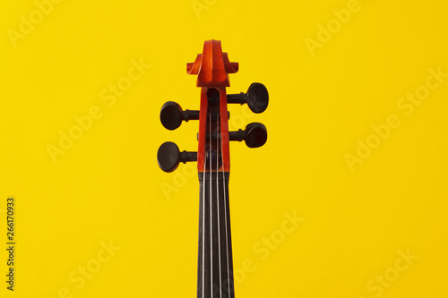 Classical music concert poster with orange color violin on yellow background with copy space for your text