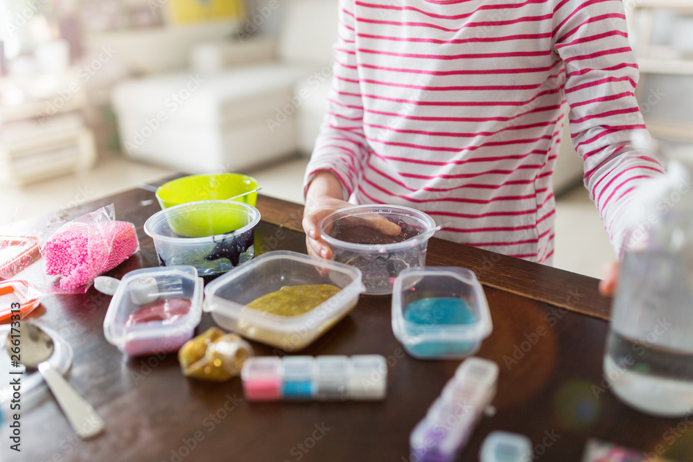 Little girl making homemade slime toy Little girl making homemade slime toy