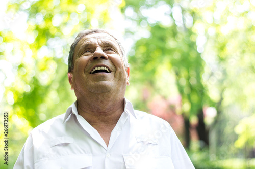Portrait of a smiling senior man in Nature