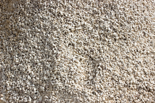 Fine white gravel for background or texture, Fine aggregate to produce concrete. Concept of modern construction. Free copy space.