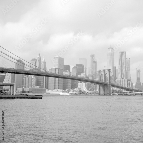 Brooklyn Bridge And A View Of Lower Manhattan. Scanned film photo. Scanned black and white film photo. Captured with a medium format SLR camera from 1960s.