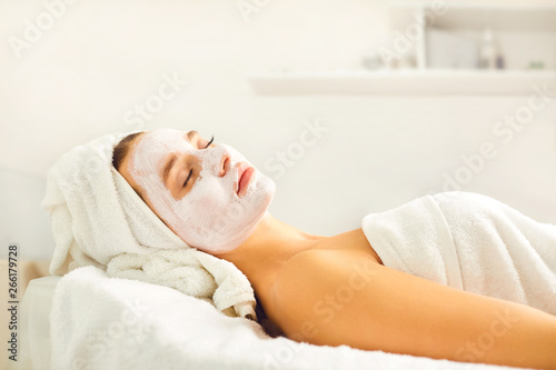 Cosmetic mask on the face of a woman in the spa salon.