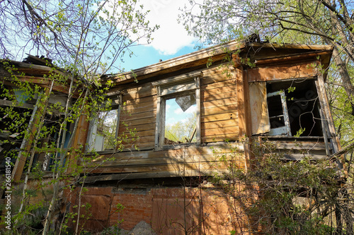Old abandoned and destroyed log house in Russia. Abandoned house in the middle of the forest