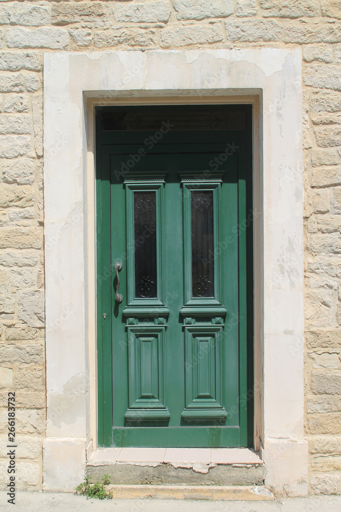 Wooden front door with glass panels