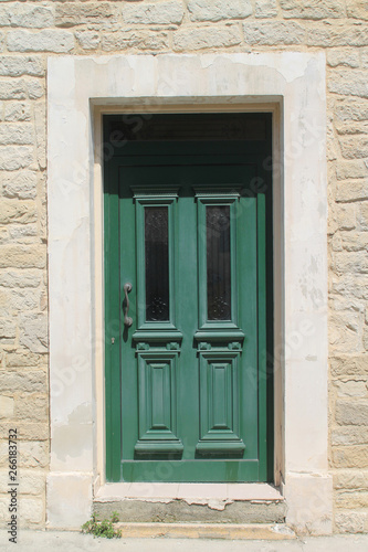 Wooden front door with glass panels