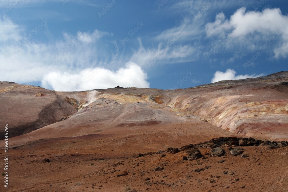 Colorful red barren isolated dry landscape under blue sky, Kerlingarfjoll in Iceland