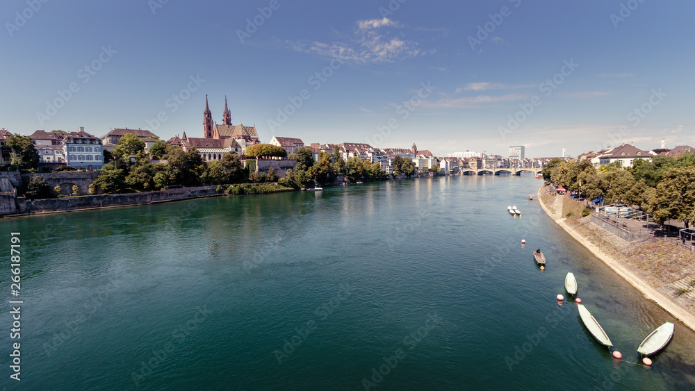 View on the Rhine river and riverside Basel from the Wettsteinbrucke on a sunny day in summer. Basel, Switzerland