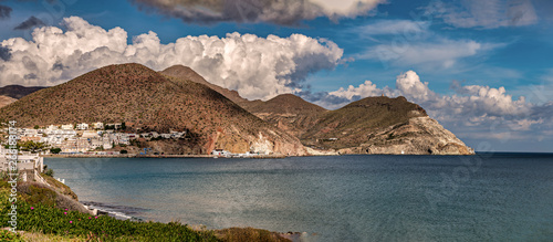 Panoramic view in the Mediterranean coast of Spain with white town in the distance.