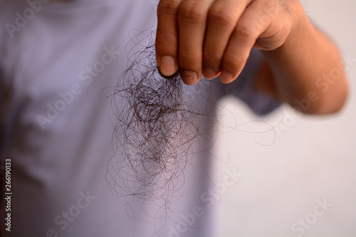 Hair loss, hair fall everyday serious problem, girl with a comb and problem hair on white background.