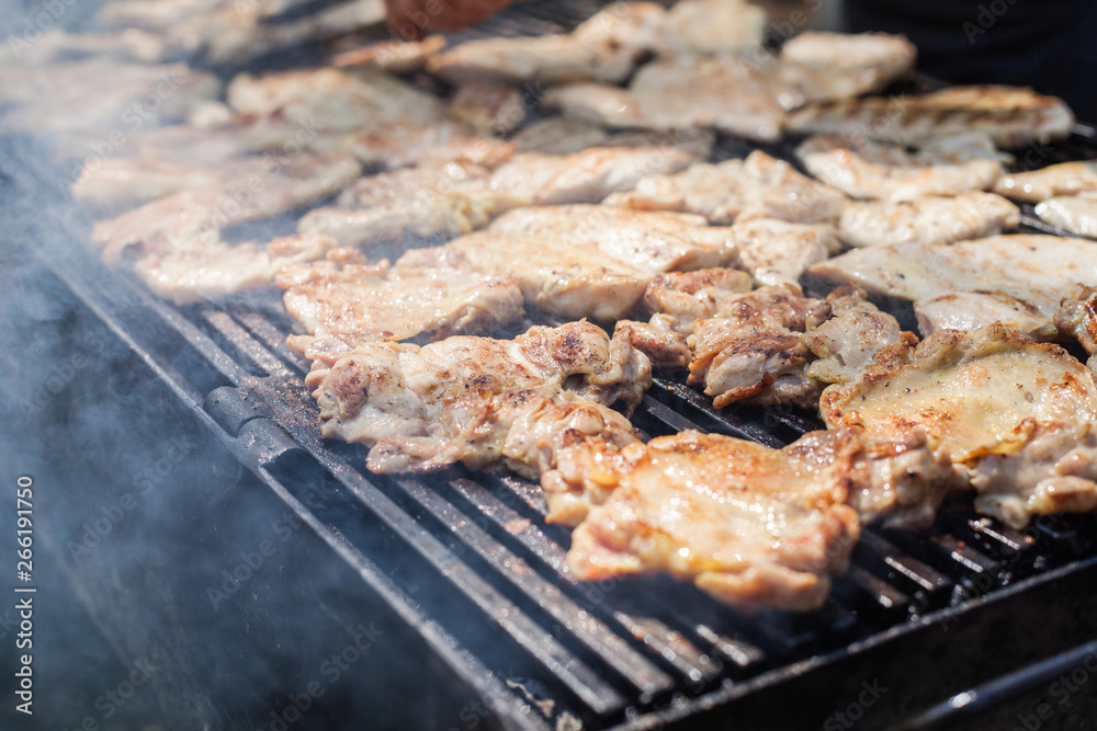 Grilled chicken meat on barbecue outdoor