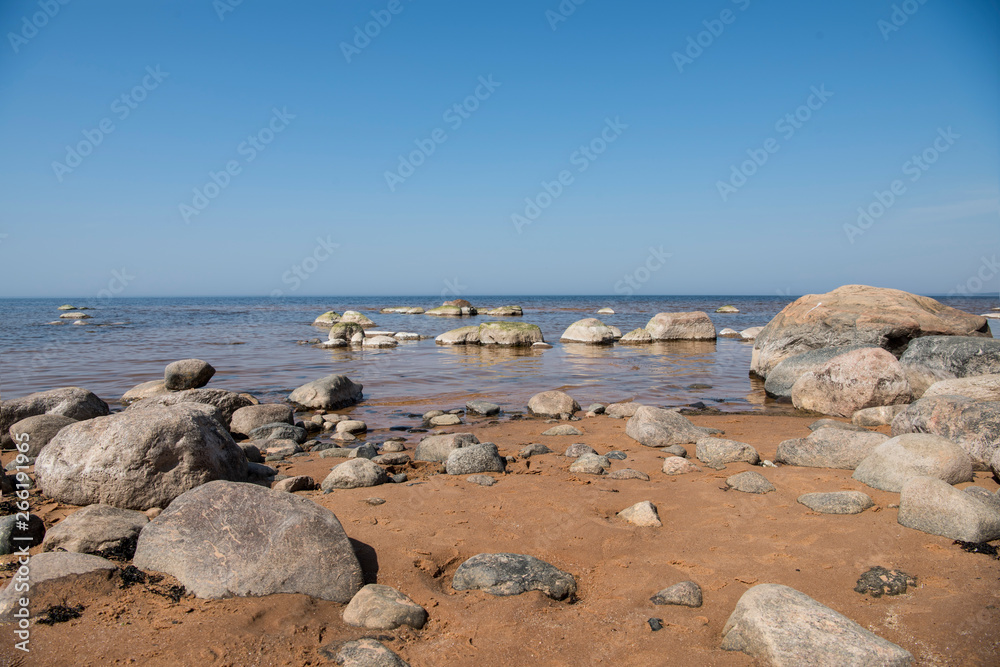 Stones balance on the beach. Place on Latvian coasts called Veczemju klintis Stones balance on the beach. Place on Latvian coasts called Veczemju klintis
