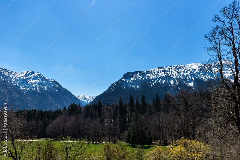Road View on the Alps in Germany, Bavaria from the car during early spring season, vacation period concept