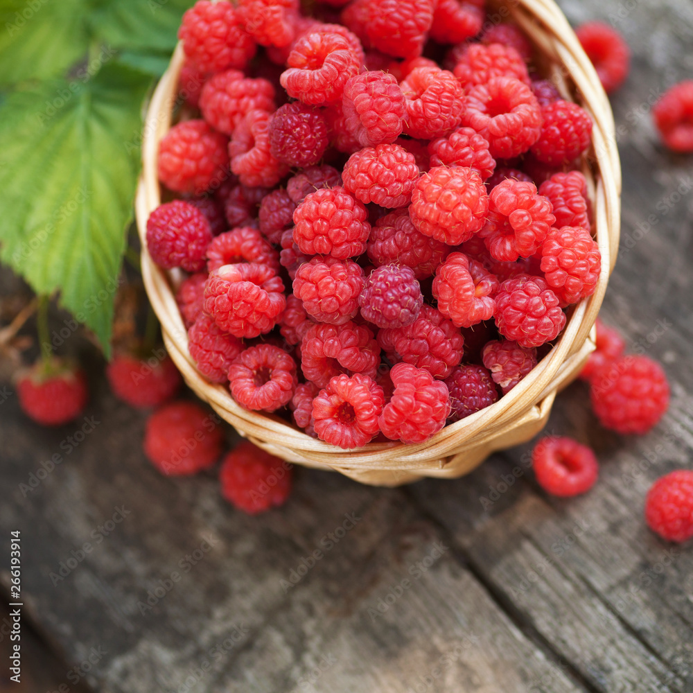 Ripe juicy raspberries on wooden background Ripe juicy raspberries on wooden background