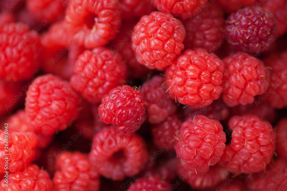 Ripe juicy raspberries on wooden background Ripe juicy raspberries on wooden background